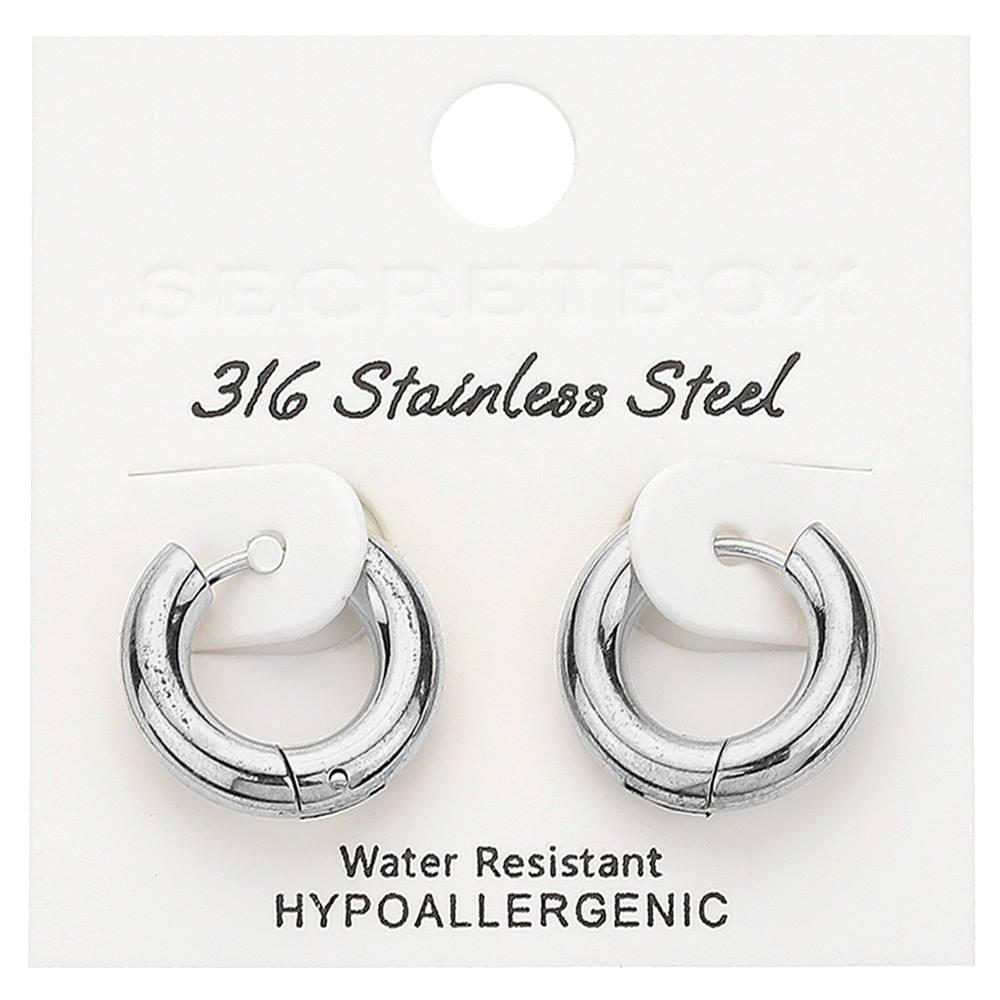 Rhodium SECRET BOX Stainless Steel Huggie Hoop Earrings are the perfect accessory for any occasion. Made from high-quality stainless steel, they offer durability and a sleek, modern look. With a secure huggie hoop design, these earrings provide both comfort and style. Elevate your outfit with these versatile and sophisticated earrings.