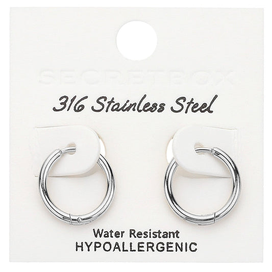 Rhodium SECRET BOX Stainless Steel Huggie Hoop Earrings offer a sleek and durable design. Made from high-quality stainless steel, they are hypoallergenic and perfect for everyday wear. Their huggie hoop style ensures a secure fit, making them the ideal accessory for any occasion.