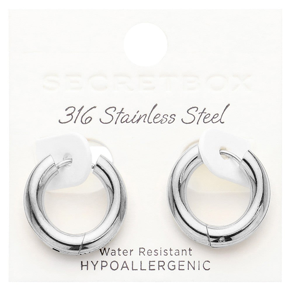 Rhodium SECRET BOX stainless steel round classic hoop earrings combine durability and style with a sleek design. Made from high-quality stainless steel, they are perfect for everyday wear and provide a classic and timeless look. Elevate your accessory game with these versatile and long-lasting earrings.