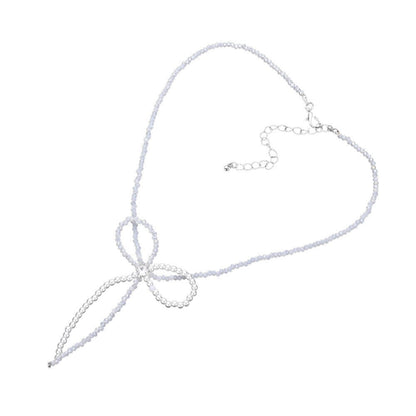 Rhodium SECRET BOX_Stone Pointed Faceted Beaded Bow Necklace is expertly crafted with precision and style. The pointed faceted beads create a unique and eye-catching design, while the delicate bow adds a touch of elegance. Perfect for adding a sophisticated touch to any outfit.
