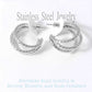 Rhodium Stainless Steel Textured Split Hoop Earrings are the perfect combination of style and durability. Made from high-quality stainless steel, these earrings feature a unique textured design that adds a touch of elegance to any outfit. With their split hoop design, they are comfortable to wear and will stay securely in place all day long. Elevate any look with these versatile and eye-catching earrings.