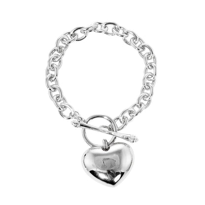Rhodium White Gold Dipped Metal Heart Charm Toggle Bracelet is a stunning addition to any jewelry collection. Crafted with precision and dipped in white gold, the heart charm adds a touch of elegance to any outfit. The toggle closure ensures a secure fit, perfect for everyday wear or special occasions.