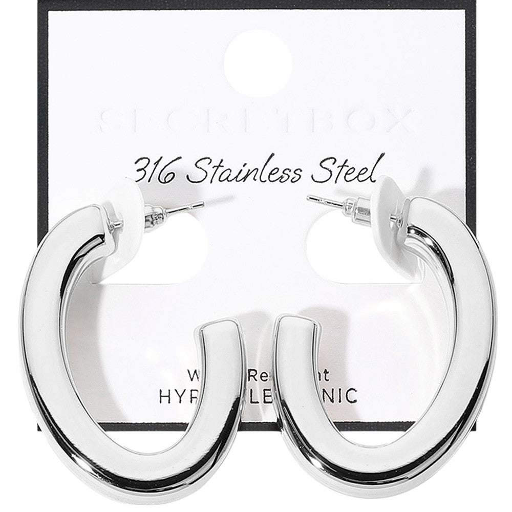 Rhodium SECRET BOX_Stainless Steel Oval Hoop Earrings are crafted from hypoallergenic stainless steel, making them a safe and comfortable option for everyday wear. Sleek and stylish, their oval shape will add a touch of elegance to any outfit. Expertly designed for long-lasting durability.