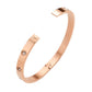 Gold Rose Stainless Steel Crystal Embellished Bangle Evening Bracelet is a must-have accessory for any evening event. Made with durable stainless steel and adorned with dazzling crystals, this bracelet adds a touch of elegance and sophistication. Perfect for a formal dinner or a night out on the town.