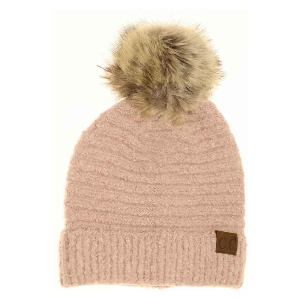 Rose Solid Boucle Knit Pom CC Beanie combines texture and warmth through its soft boucle knit fabric. Designed for expert-level comfort, this beanie features a classic silhouette topped with a playful pom for a refined yet casual look. Ideal for cold weather, it offers durable insulation while maintaining breathability, making it a versatile accessory for everyday wear. 