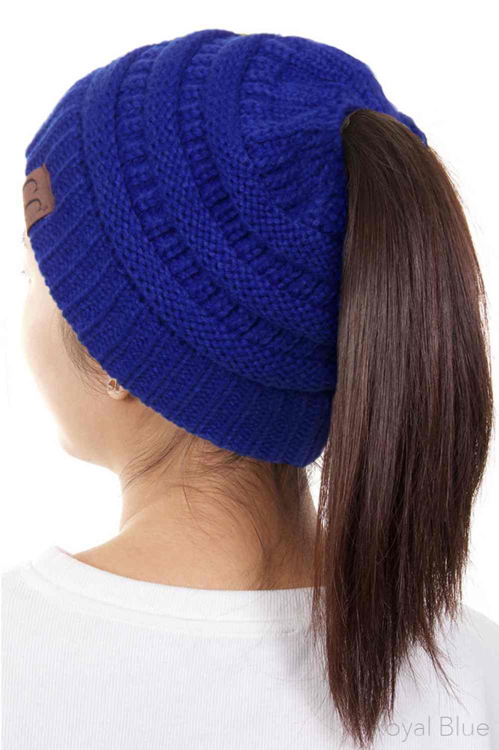 Royal Blue The C.C Solid Color Ponytail Messy Bun Beanie combines comfort with versatility for effortless everyday style. Crafted from 100% soft acrylic, this beanie features an open crown design that accommodates ponytails and messy buns while keeping you warm. The one-size-fits-most construction ensures a secure, flattering fit for virtually anyone. Perfect for casual outings, workouts, or relaxed weekends, this practical accessory transitions seamlessly from season to season.