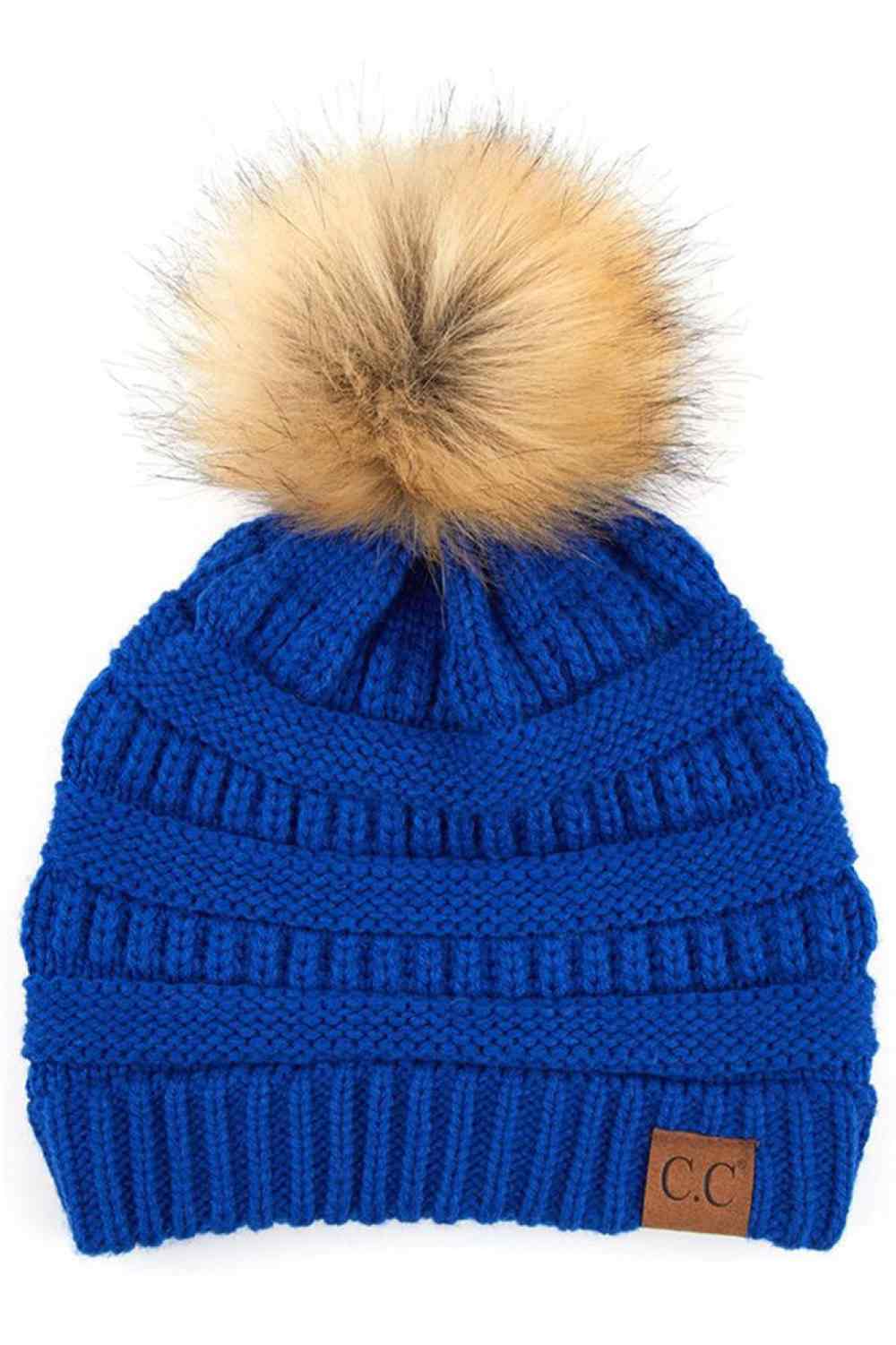 Royal Blue Stay warm and cozy with this classic C.C Pom Pom Knit Beanie, crafted from 100% soft acrylic for all-day comfort. The ribbed knit design adds texture and durability, while the signature pom pom on top brings a playful touch to any winter outfit. One size fits most, making it the perfect accessory for everyone. Ideal for cold weather adventures or casual everyday wear.