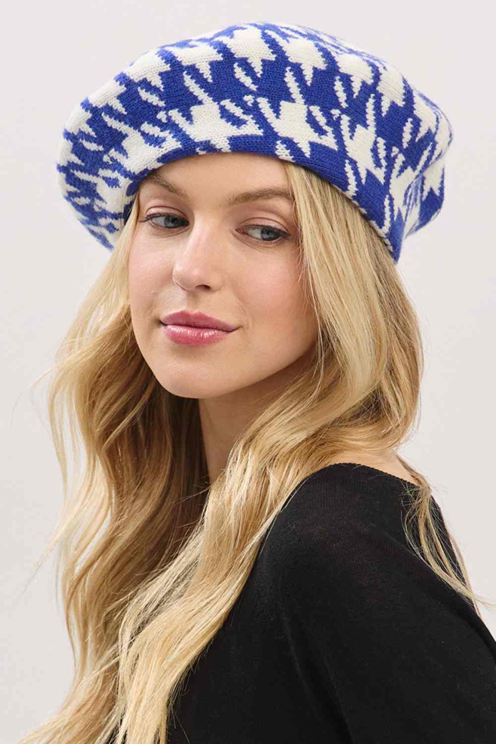 Royal Blue Elevate your winter style with this sophisticated houndstooth pattern beret featuring a striking two-tone knit design. Crafted from 100% acrylic for durability and comfort, this one-size beret delivers timeless elegance whether you're dressing up or keeping it casual. The classic houndstooth pattern adds visual interest to any outfit, making it the perfect accessory for cooler months.