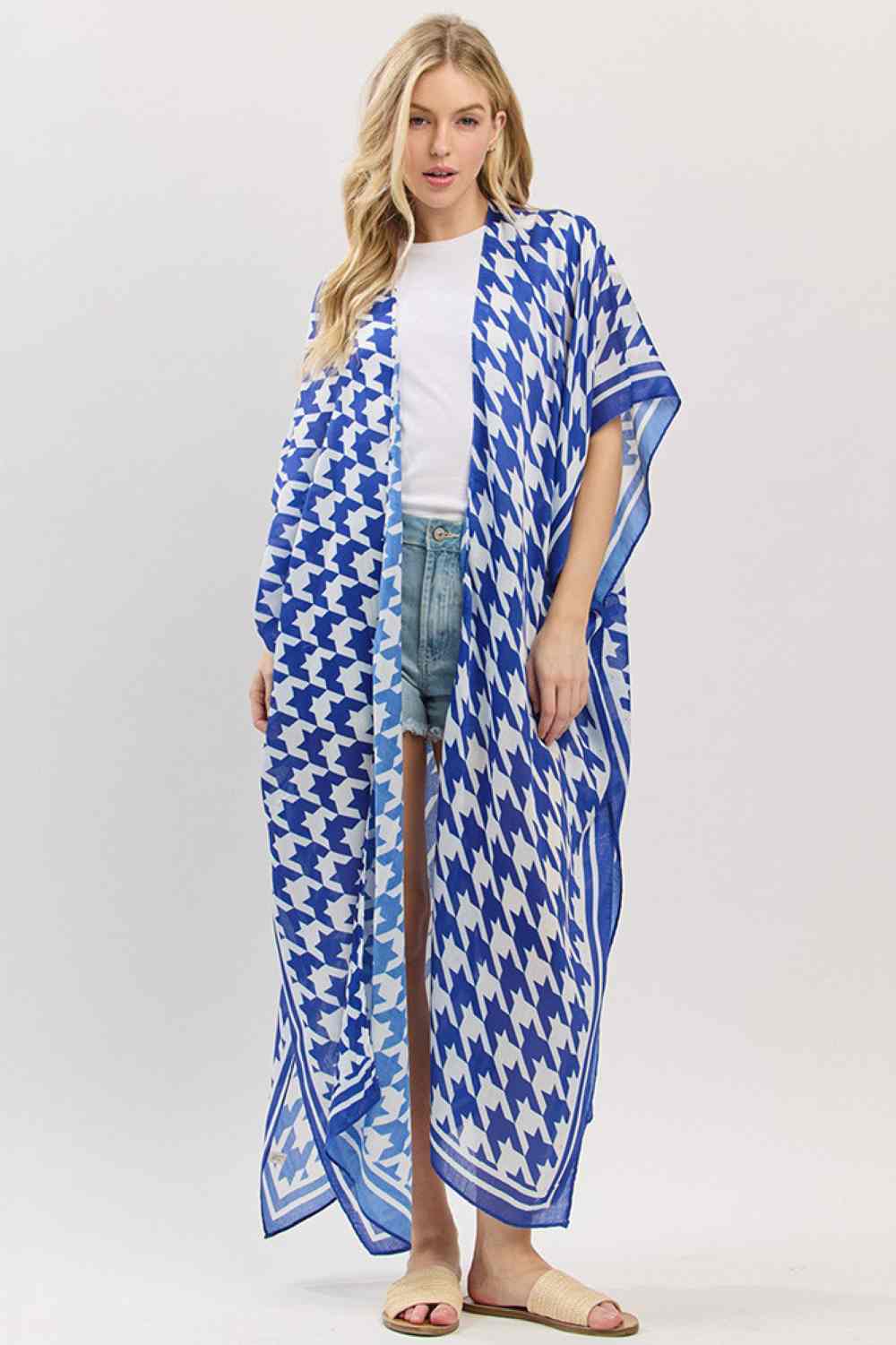 Royal Blue Effortless summer style meets timeless elegance with this houndstooth pattern kimono. The open front design drapes beautifully over swimwear or casual outfits, while the generous 35" x 47.5" dimensions provide complete coverage for beach days and poolside lounging. Crafted from lightweight 100% polyester, it's breathable, quick-drying, and easy to care for. Perfect for layering over your favorite beach look or wearing as a standalone cover-up. Transition seamlessly from sand to dinner with this v