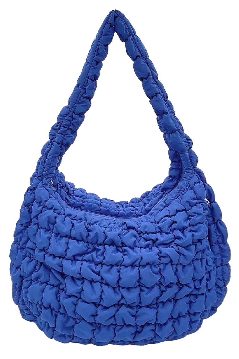 Royal Blue Carry your essentials in style with this Large Quilted Solid Bag. Crafted from durable 100% polyester with a classic quilted design, it offers a sleek, versatile look that complements any outfit. The adjustable sling strap allows for comfortable crossbody wear, making it perfect for everyday errands, travel, or casual outings.