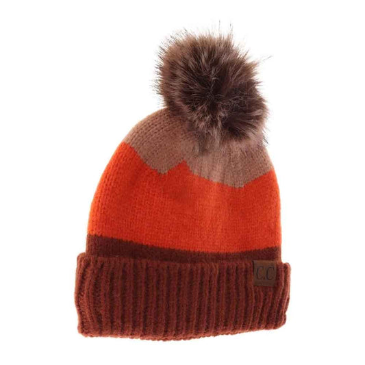 Rust C.C Multi Color Block Stripes Pom Beanie, wear it before running out the door into the cool air to keep yourself warm and toasty and look absolutely beautiful. You’ll want to reach for this toasty beanie to keep you incredibly warm everywhere and every occasion. Accessorize the fun way with this pom hat. 