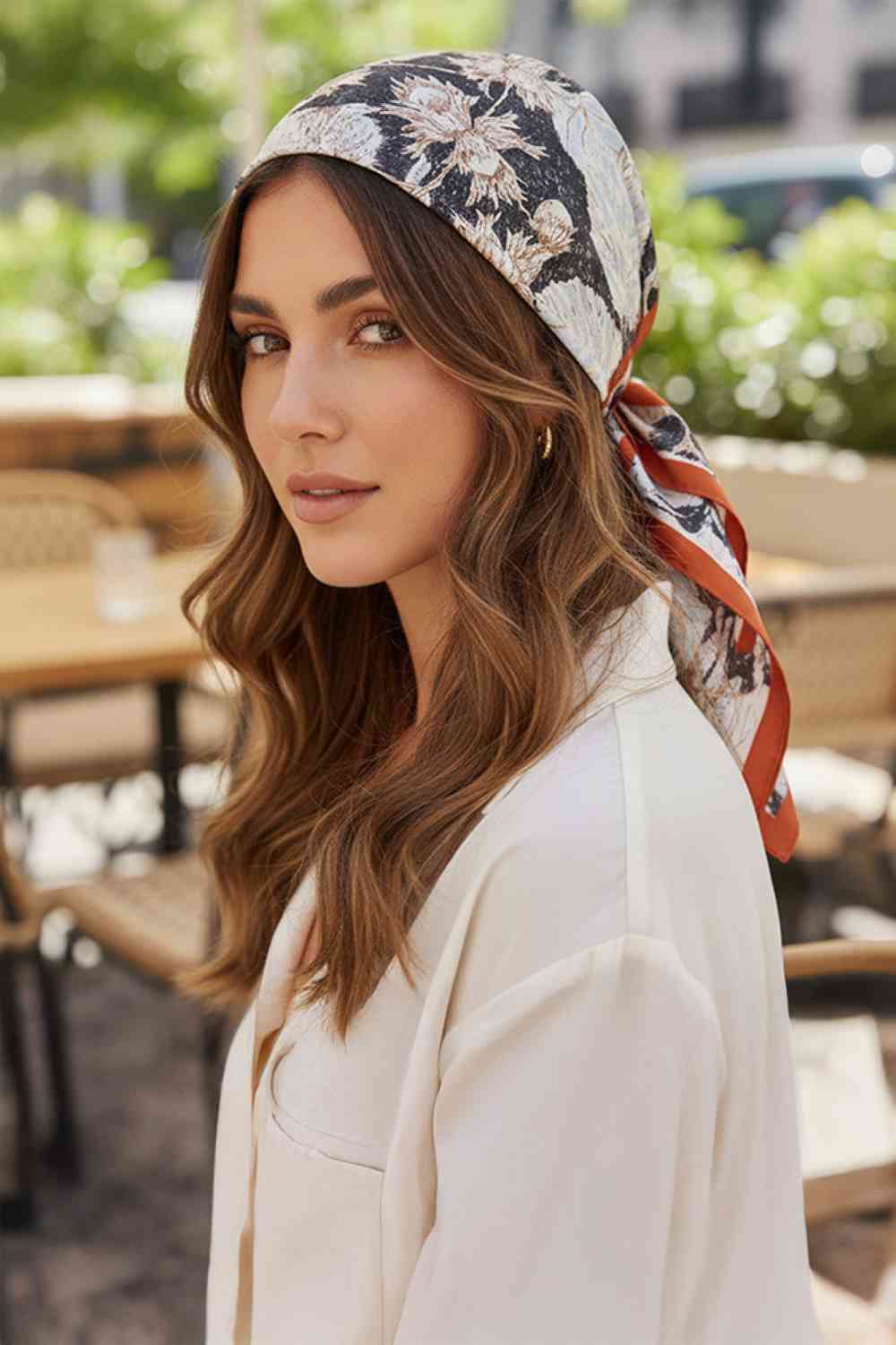 Rust Elevate your accessory game with this versatile Abstract Floral Print Bandana Scarf. Featuring a striking abstract floral design with bold solid thick lines, this lightweight scarf is crafted from 100% polyester for a silky-smooth feel against your skin. Perfect for any season, wear it as a headwrap, neck scarf, or tie it to your bag for an instant style boost. The generous 35" x 35" square cut gives you endless styling possibilities. Whether you're dressing up or keeping it casual, this all-season ess