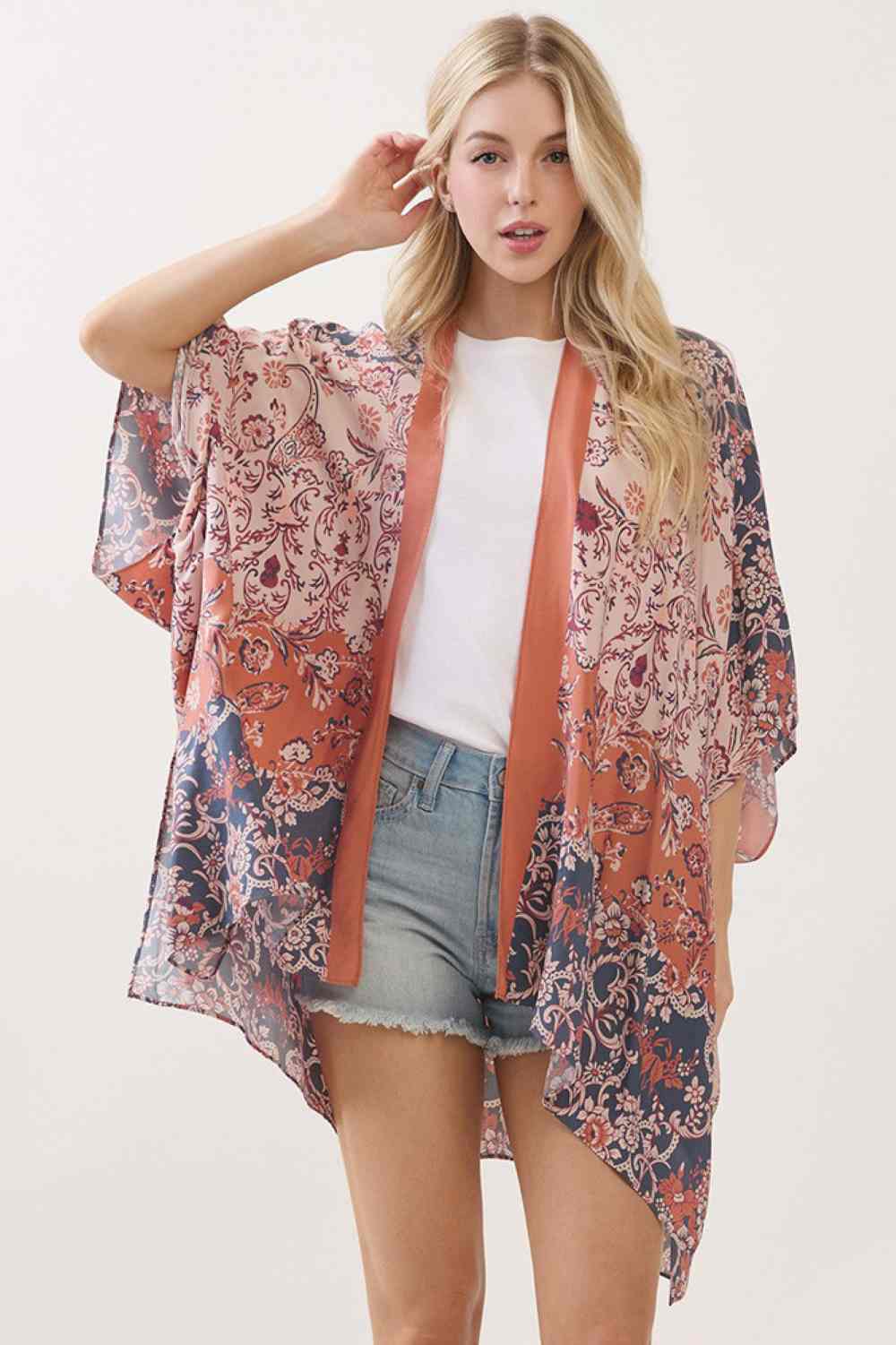 Rust Embrace effortless elegance with this bohemian kimono cover up, featuring a captivating floral paisley print that brings artistic flair to any outfit. Crafted from 100% viscose, the fabric drapes beautifully while offering a soft, breathable feel perfect for layering over swimwear or casual wear. Measuring 40" x 60", it provides generous coverage and versatile styling options. Whether you're heading to the beach, poolside, or looking for a lightweight layer for warm weather, this piece combines comfort