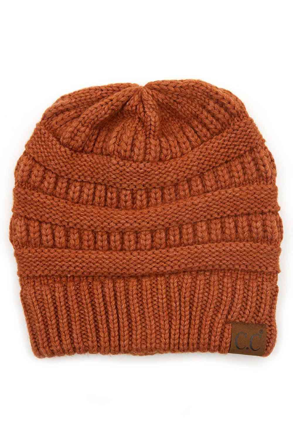 Rust Wrap yourself in softness with this C.C Soft Yarn Knit Beanie, crafted from a premium blend of 47% rayon, 31% PBT, and 22% nylon. The luxurious rayon provides a silky feel against your skin, while the durable synthetic fibers ensure lasting wear through winter season.