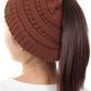 Rust The C.C Solid Color Ponytail Messy Bun Beanie combines comfort with versatility for effortless everyday style. Crafted from 100% soft acrylic, this beanie features an open crown design that accommodates ponytails and messy buns while keeping you warm. The one-size-fits-most construction ensures a secure, flattering fit for virtually anyone. Perfect for casual outings, workouts, or relaxed weekends, this practical accessory transitions seamlessly from season to season.