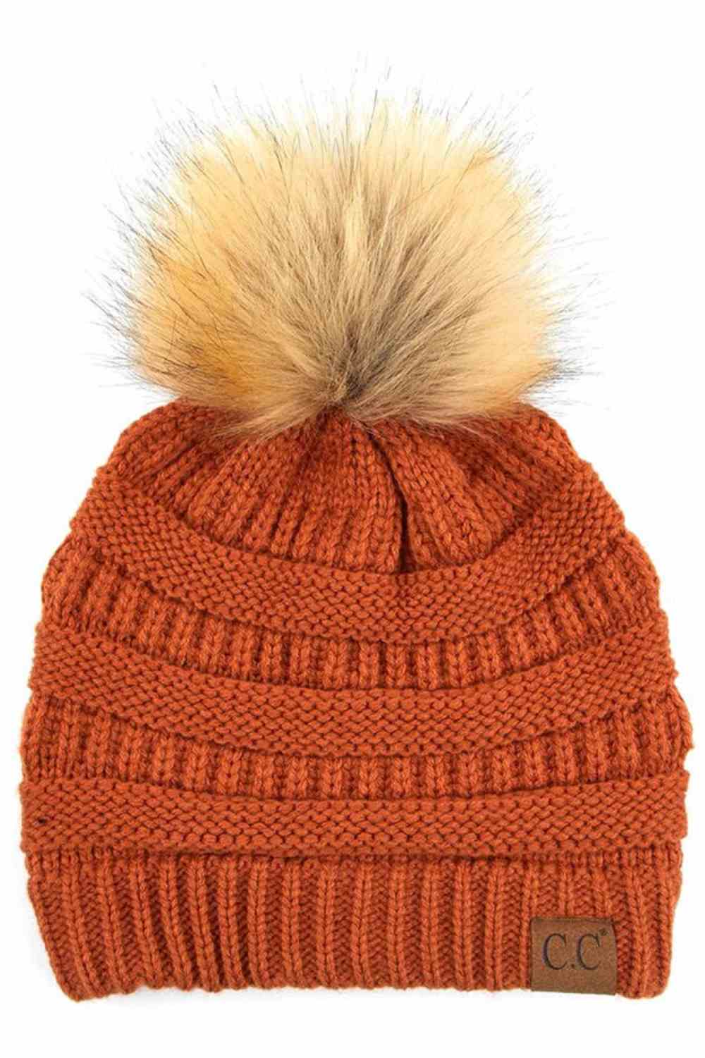 Rust Stay warm and cozy with this classic C.C Pom Pom Knit Beanie, crafted from 100% soft acrylic for all-day comfort. The ribbed knit design adds texture and durability, while the signature pom pom on top brings a playful touch to any winter outfit. One size fits most, making it the perfect accessory for everyone. Ideal for cold weather adventures or casual everyday wear.
