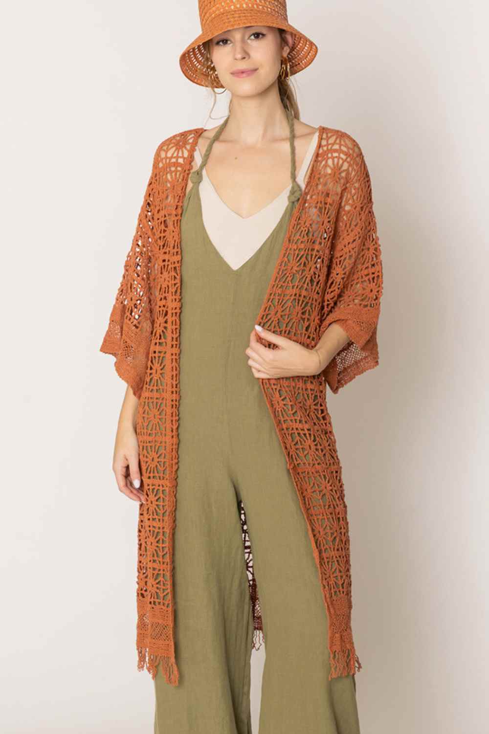 Rust Effortless elegance meets comfort in this timeless crochet cardigan. Crafted from 100% cotton, it features an open-weave design that's breathable and perfect for layering. The relaxed fit measures 44" in length with a 20.5" width, offering a flattering silhouette for various body types. Ideal for casual days or dressed-up occasions, this versatile piece transitions seamlessly from season to season. A wardrobe staple that combines style with everyday wearability.