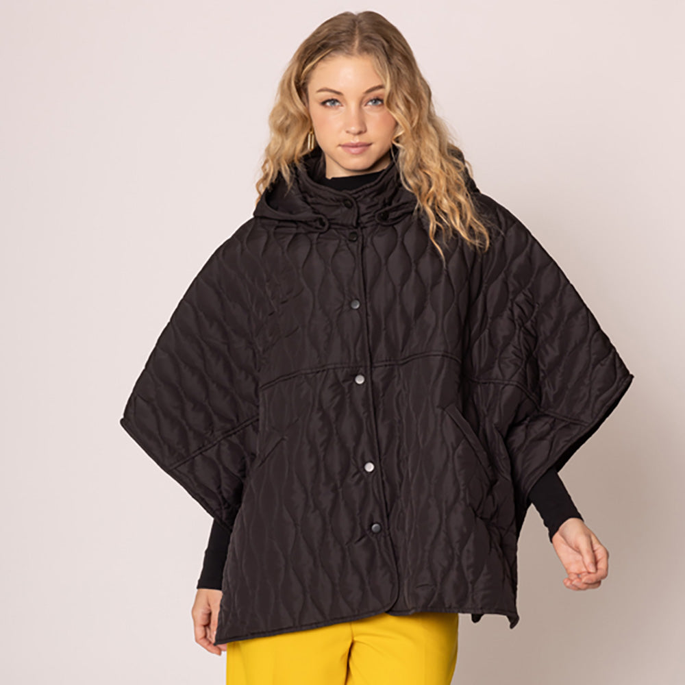 Black Stylish quilted cape jacket featuring a relaxed silhouette, button-up front, and attached hood for added comfort. Perfect for layering during cooler seasons, this versatile outerwear piece combines warmth with a modern, minimalistic design for effortless everyday style.