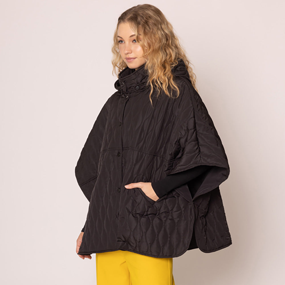 Black Stylish quilted cape jacket featuring a relaxed silhouette, button-up front, and attached hood for added comfort. Perfect for layering during cooler seasons, this versatile outerwear piece combines warmth with a modern, minimalistic design for effortless everyday style.