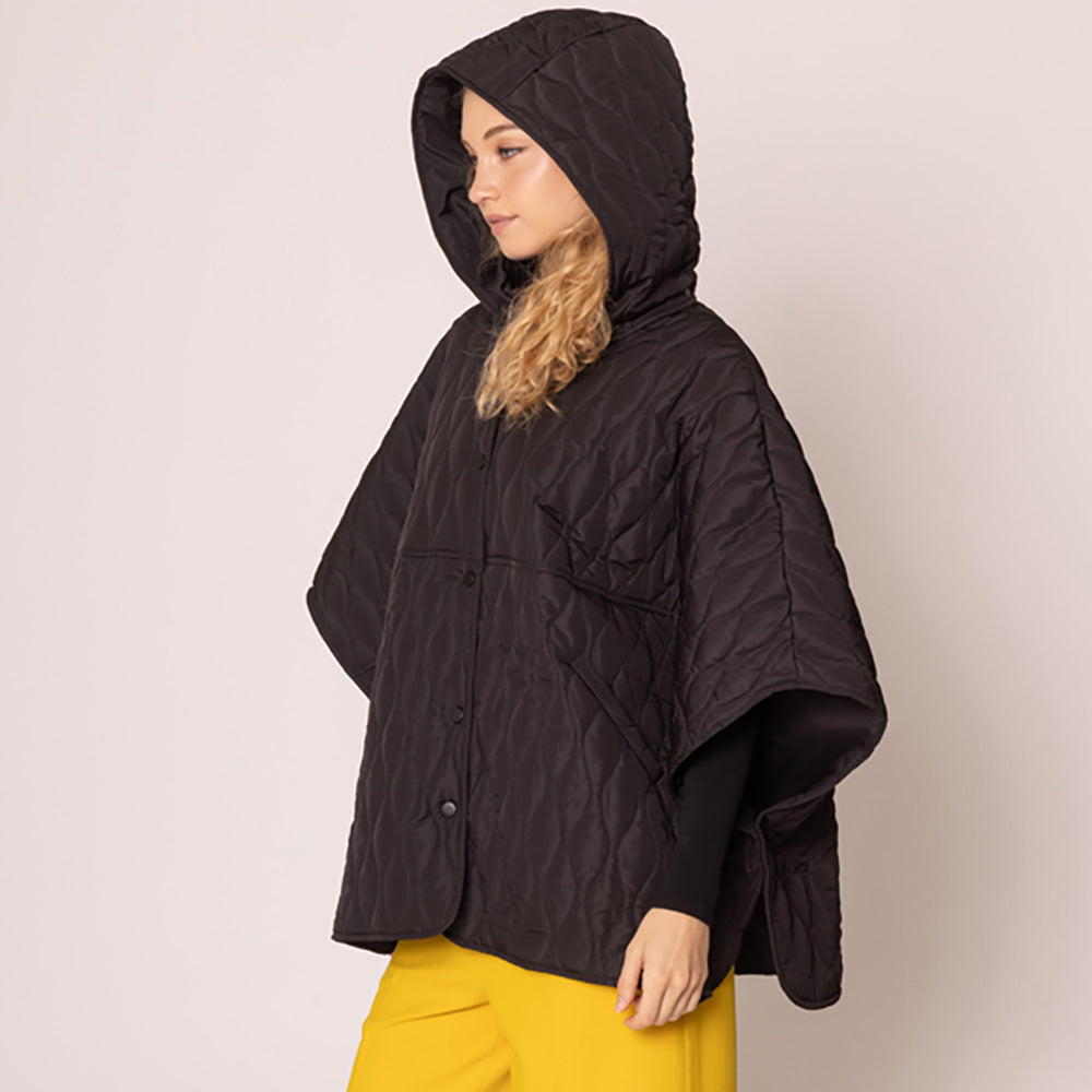 Black Stylish quilted cape jacket featuring a relaxed silhouette, button-up front, and attached hood for added comfort. Perfect for layering during cooler seasons, this versatile outerwear piece combines warmth with a modern, minimalistic design for effortless everyday style.