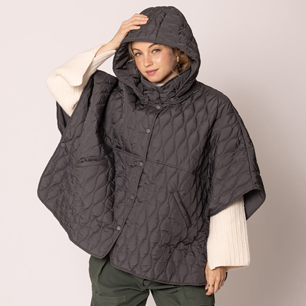 Charcoal Stylish quilted cape jacket featuring a relaxed silhouette, button-up front, and attached hood for added comfort. Perfect for layering during cooler seasons, this versatile outerwear piece combines warmth with a modern, minimalistic design for effortless everyday style.