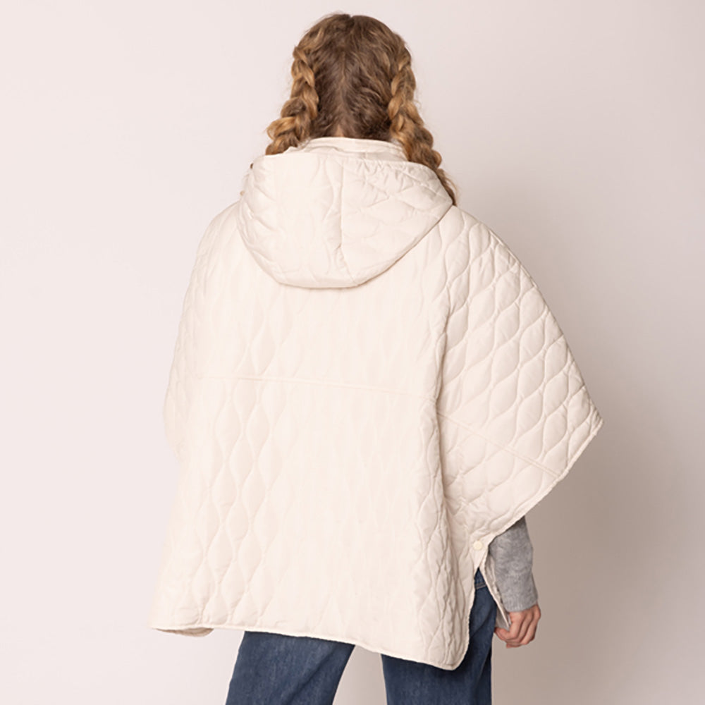 Ivory Stylish quilted cape jacket featuring a relaxed silhouette, button-up front, and attached hood for added comfort. Perfect for layering during cooler seasons, this versatile outerwear piece combines warmth with a modern, minimalistic design for effortless everyday style.