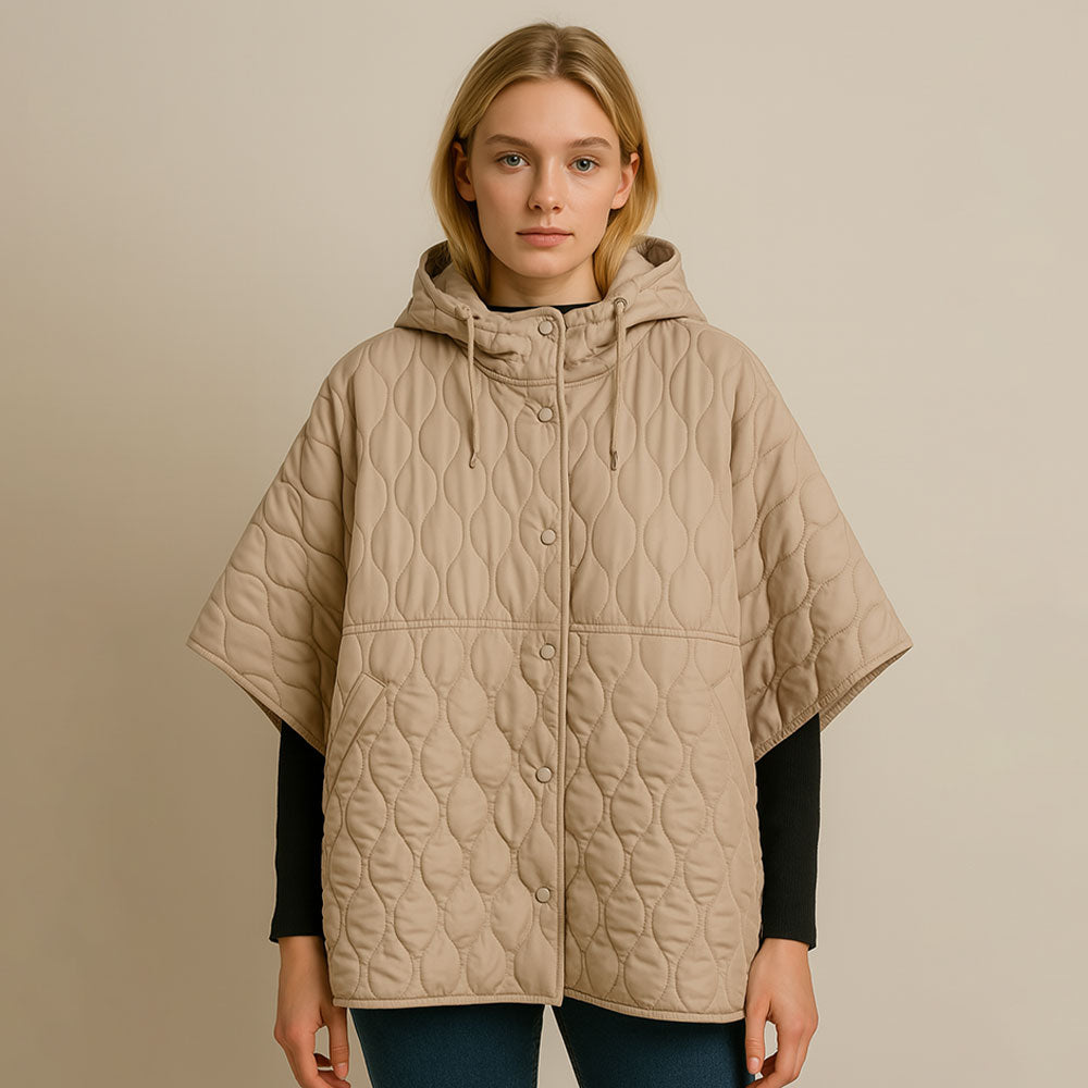 Tan Stylish quilted cape jacket featuring a relaxed silhouette, button-up front, and attached hood for added comfort. Perfect for layering during cooler seasons, this versatile outerwear piece combines warmth with a modern, minimalistic design for effortless everyday style.