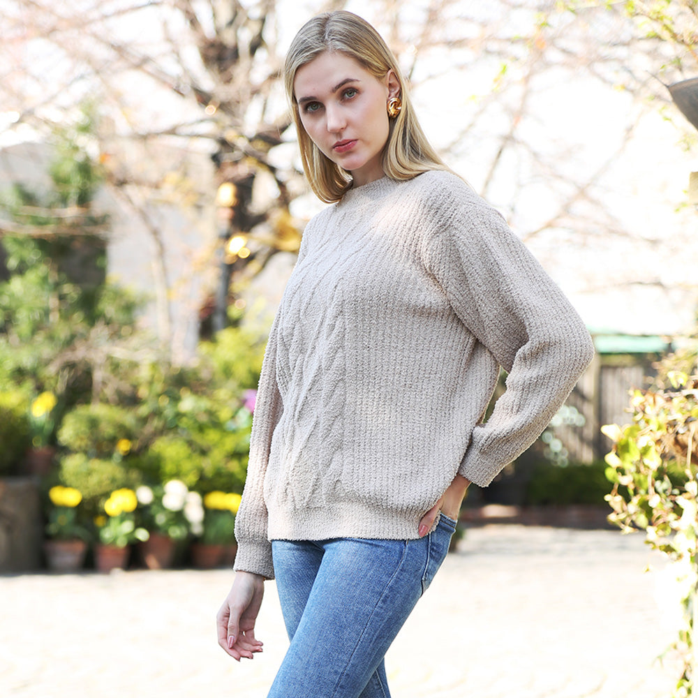 Wrap yourself in comfort with this Solid Color Ribbed Sweater, designed for effortless style and warmth. Its soft ribbed knit fabric offers a flattering fit and timeless look, perfect for pairing with jeans or skirts for any occasion.