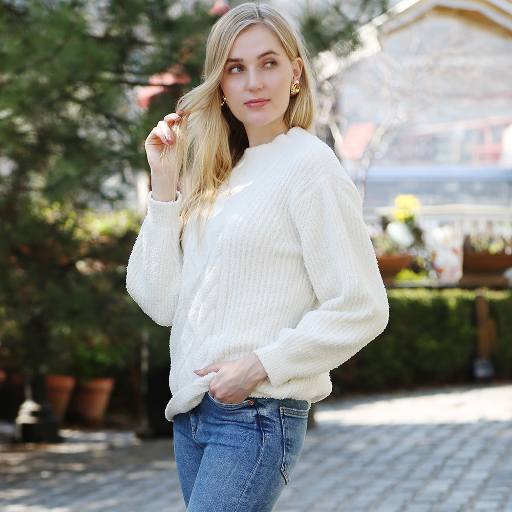 Wrap yourself in comfort with this Solid Color Ribbed Sweater, designed for effortless style and warmth. Its soft ribbed knit fabric offers a flattering fit and timeless look, perfect for pairing with jeans or skirts for any occasion.