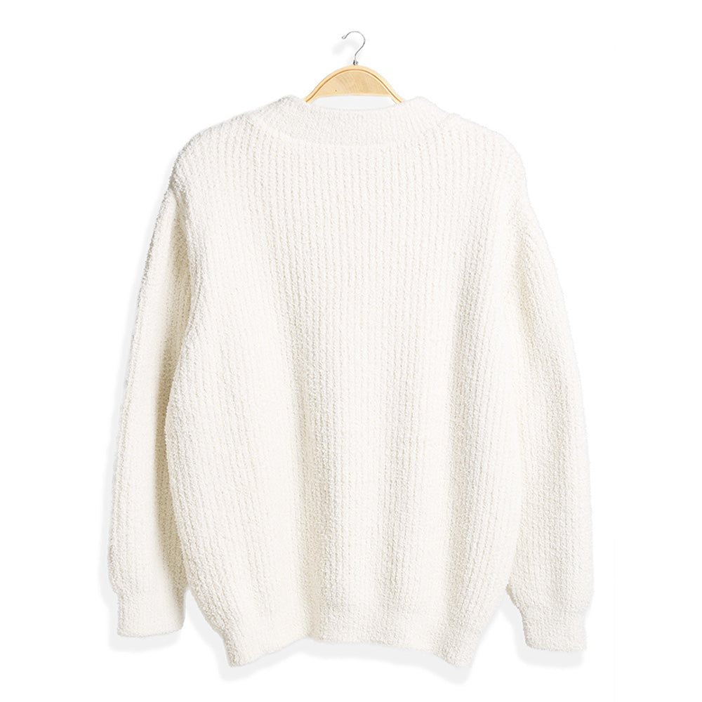 Wrap yourself in comfort with this Solid Color Ribbed Sweater, designed for effortless style and warmth. Its soft ribbed knit fabric offers a flattering fit and timeless look, perfect for pairing with jeans or skirts for any occasion.