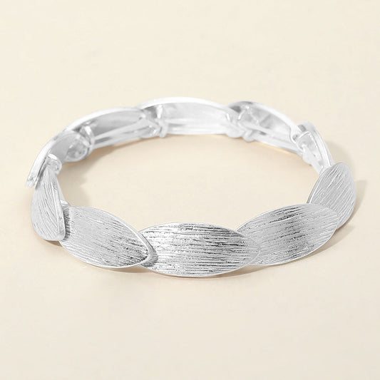 Madeline Love Worn Silver Textured Metal Oval Overlapped Beaded Stretch Bracelet - Bracelets