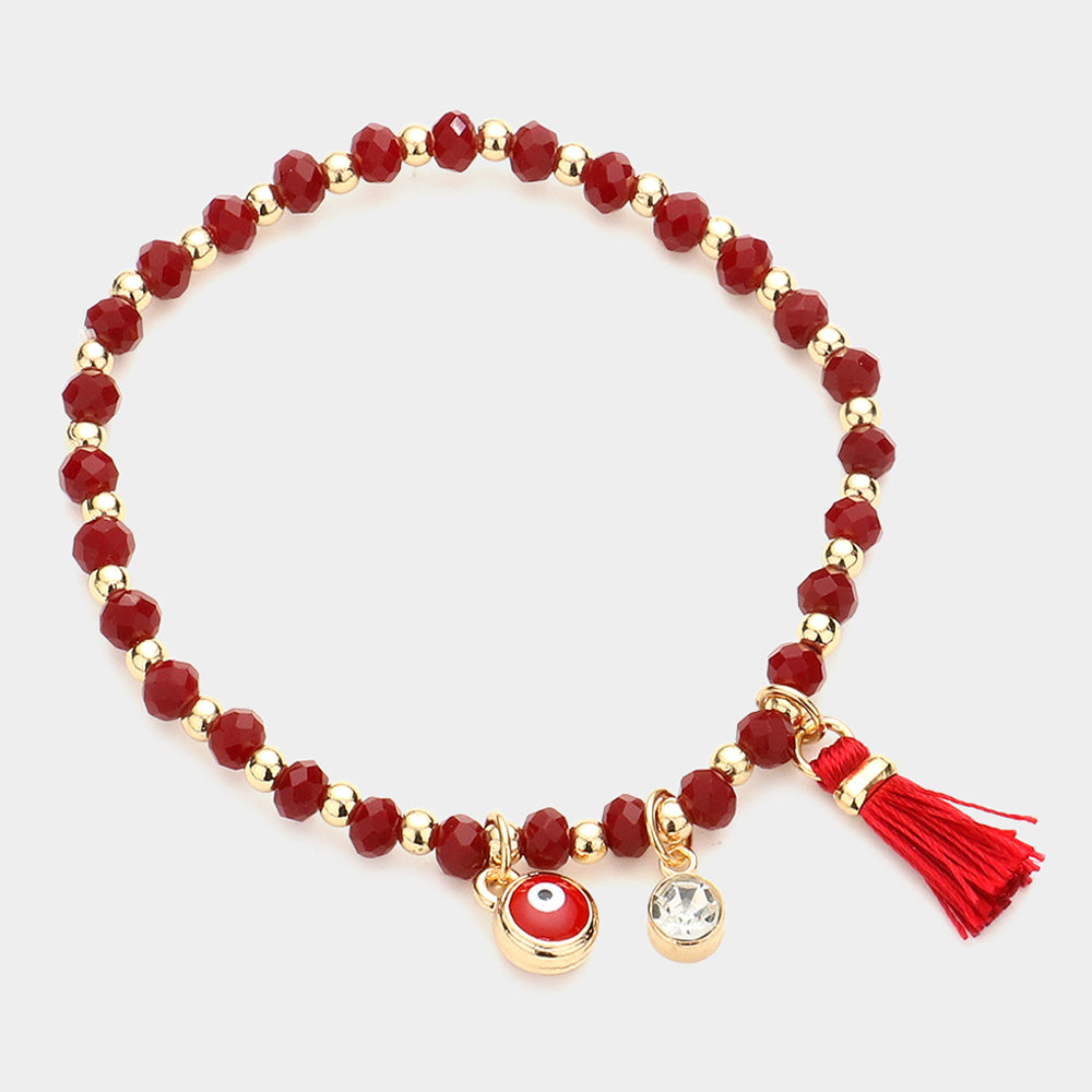 Madeline Love Gold, Red Evil Eye Round Stone Tassel Charm Faceted Beaded Stretch Bracelet - Bracelets