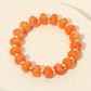Madeline Love Gold, Orange Resin Round Beaded Stretch Bracelet - Bracelets
