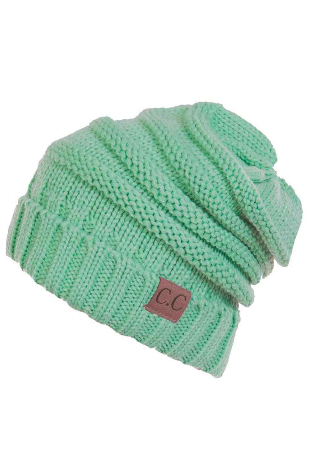 Sage Wrap yourself in warmth with this C.C Slouchy Knitted Beanie, crafted from 100% soft acrylic for ultimate comfort. The oversized silhouette and plush pom pom detail create a relaxed, on-trend look perfect for chilly days. Available in nine versatile colors—Beige, Berry, Dark Denim, Heather Gray, Ivory, Pistachio, Rose, Steel Blue, and Violet Purple—this beanie pairs effortlessly with any winter wardrobe. The ribbed knit construction ensures durability and a flattering fit.