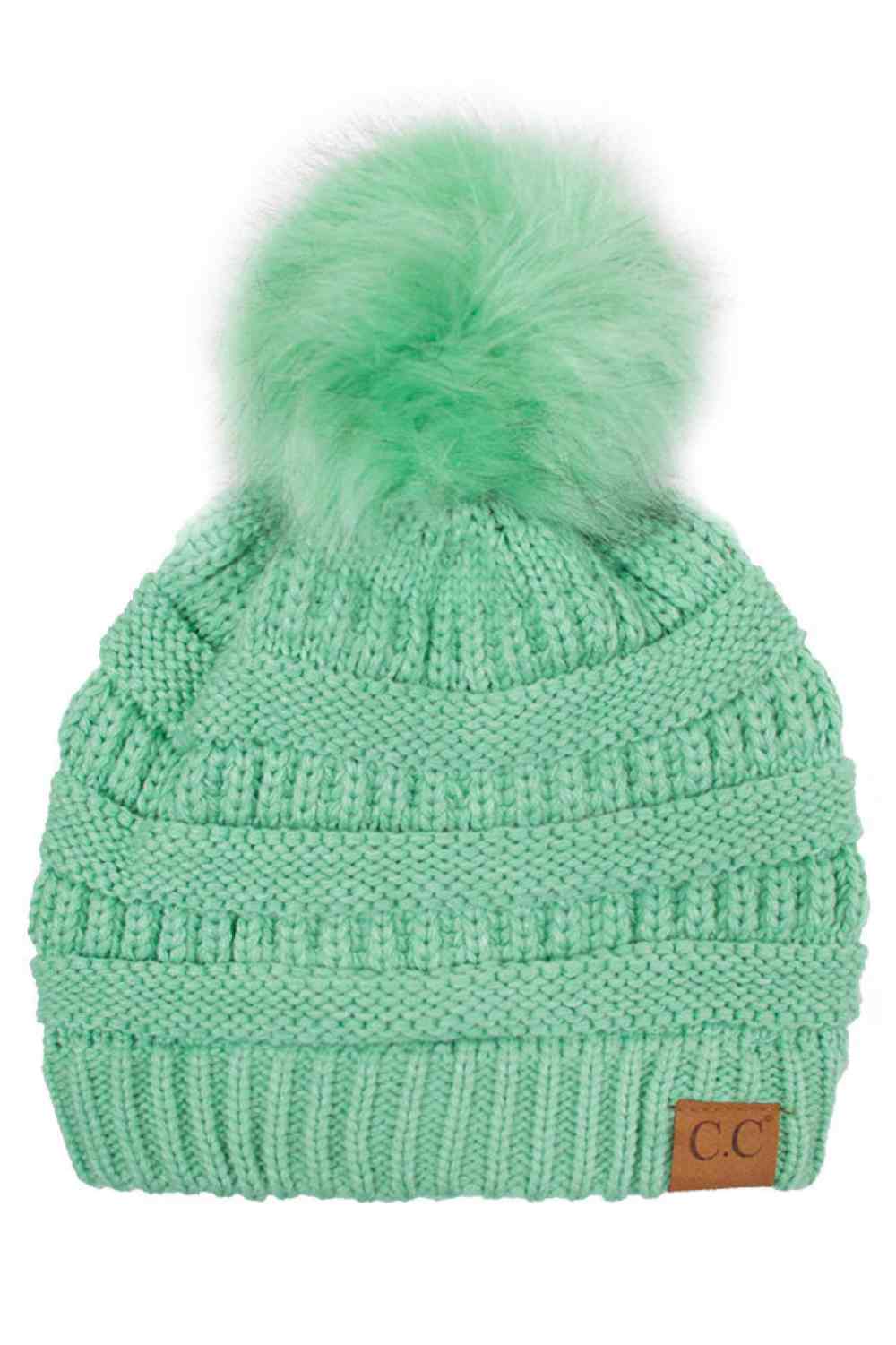 Sage Elevate your winter wardrobe with this classic C.C knitted beanie, crafted from 100% soft acrylic for exceptional warmth and comfort. The signature fur pom pom adds a touch of sophistication, while the one-size-fits-most design ensures a flattering fit for virtually anyone. Perfect for layering during cold months, this versatile beanie transitions seamlessly from casual outings to outdoor adventures. The premium acrylic blend resists pilling and maintains its shape season after season, making it a reli
