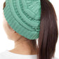 Sage The C.C Solid Color Ponytail Messy Bun Beanie combines comfort with versatility for effortless everyday style. Crafted from 100% soft acrylic, this beanie features an open crown design that accommodates ponytails and messy buns while keeping you warm. The one-size-fits-most construction ensures a secure, flattering fit for virtually anyone. Perfect for casual outings, workouts, or relaxed weekends, this practical accessory transitions seamlessly from season to season.