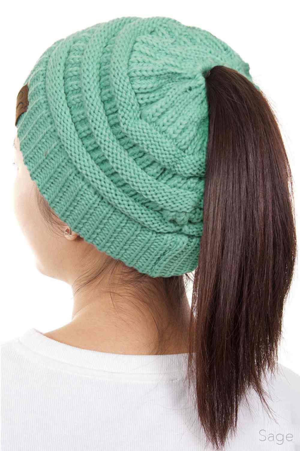 Sage The C.C Solid Color Ponytail Messy Bun Beanie combines comfort with versatility for effortless everyday style. Crafted from 100% soft acrylic, this beanie features an open crown design that accommodates ponytails and messy buns while keeping you warm. The one-size-fits-most construction ensures a secure, flattering fit for virtually anyone. Perfect for casual outings, workouts, or relaxed weekends, this practical accessory transitions seamlessly from season to season.