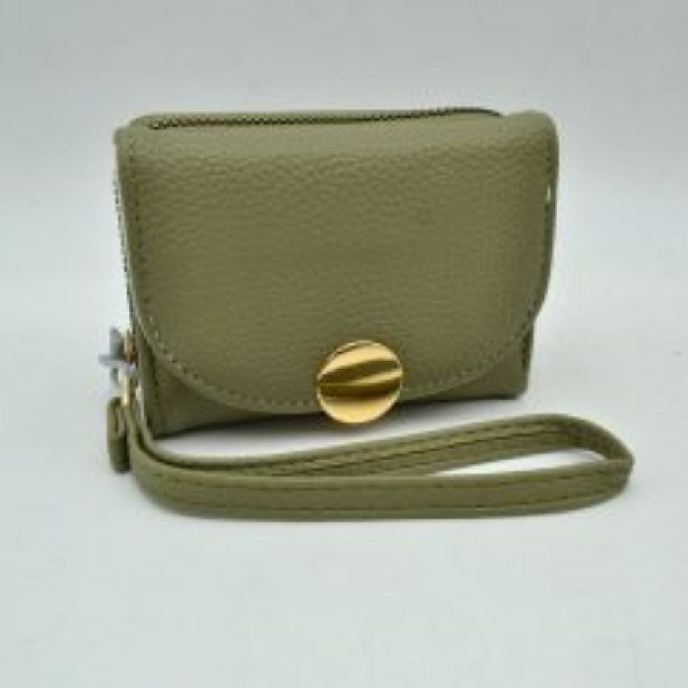 Sage green This compact everyday wallet features a pebbled, textured exterior designed for practical multi-compartment storage. It includes a secure, top zip-around section with metallic teeth alongside a front fold-over flap portion accented by a prominent round metallic button closure. For convenient carrying during daily errands, it comes equipped with a slim, matching wristlet strap attached to the side hardware.