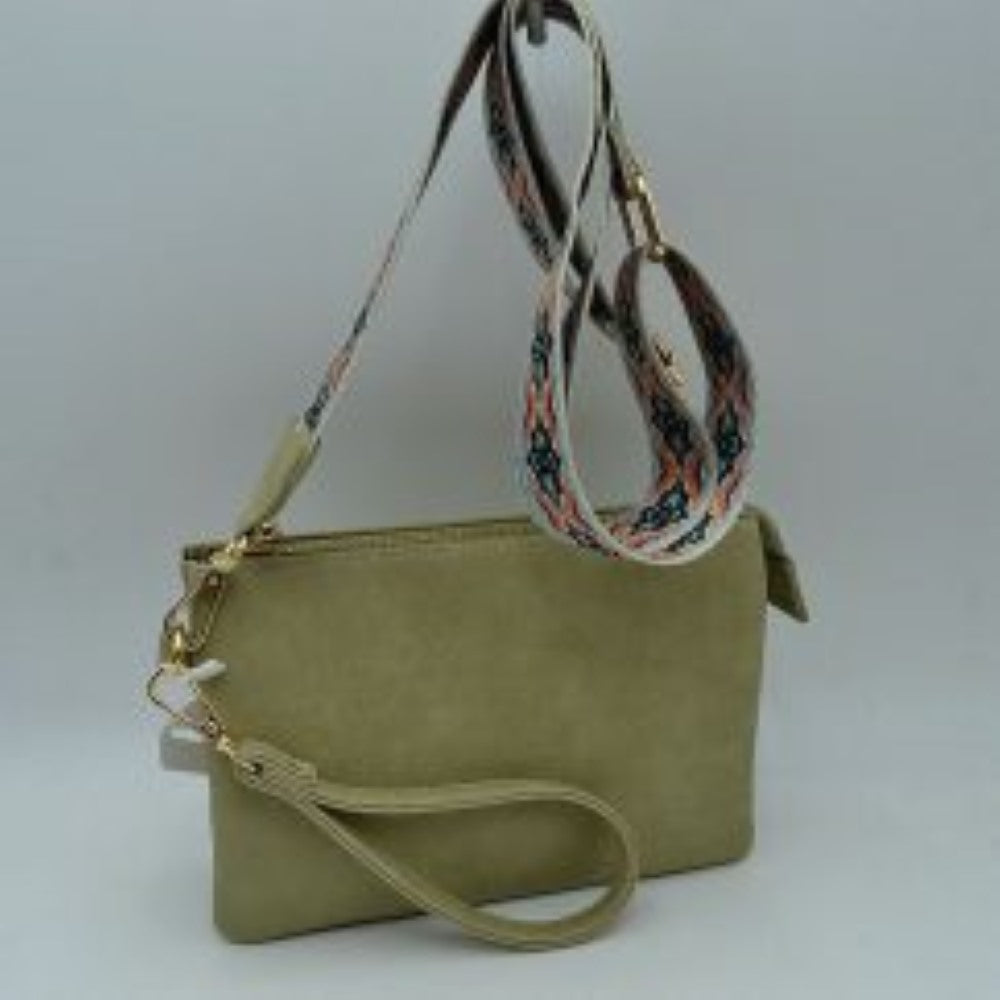 Sage green This versatile clutch is designed for seamless everyday transition and features multiple carrying options to suit your style. It is equipped with secure top zipper compartments to keep your daily essentials safely organized and within reach. For carrying flexibility, the bag comes with both a matching wristlet loop and a wide, adjustable shoulder strap decorated with a detailed geometric woven pattern, both attaching easily via sturdy metallic clasps.