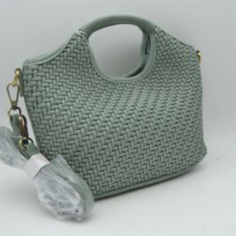 Sage Green Elevate your everyday style with this versatile woven handbag, designed to seamlessly transition from mornings on the go to casual evenings out. Featuring a unique basket-weave texture that adds a touch of sophisticated craftsmanship, this bag balances a modern silhouette with timeless appeal. It is crafted with integrated, cut-out top handles for a sleek look, and it includes a detachable, adjustable shoulder strap that allows you to effortlessly switch between a classic handbag, a relaxed shoul