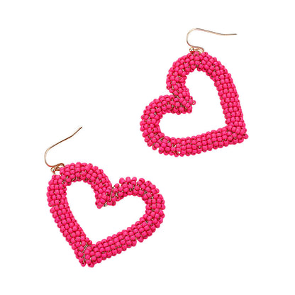 Seed Beaded Open Heart Dangle Earrings are handcrafted with delicate beads, forming an open heart that dangles elegantly. The intricate design adds a touch of romance to any outfit. These earrings are versatile and can be worn for any occasion, perfect for any fashion-forward individual. 