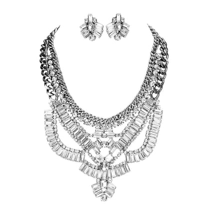Silver Antique Stone Embellished Statement Necklace crafted by Antique Stone Embellished Statement Necklace exudes vintage charm and is perfect for adding a touch of elegance to any outfit. The antique stones offer a unique and sophisticated look, making it a must-have for all fashion enthusiasts. Elevate your style with this exquisite piece. 