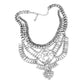 Silver Antique Stone Embellished Statement Necklace crafted by Antique Stone Embellished Statement Necklace exudes vintage charm and is perfect for adding a touch of elegance to any outfit. The antique stones offer a unique and sophisticated look, making it a must-have for all fashion enthusiasts. Elevate your style with this exquisite piece. 
