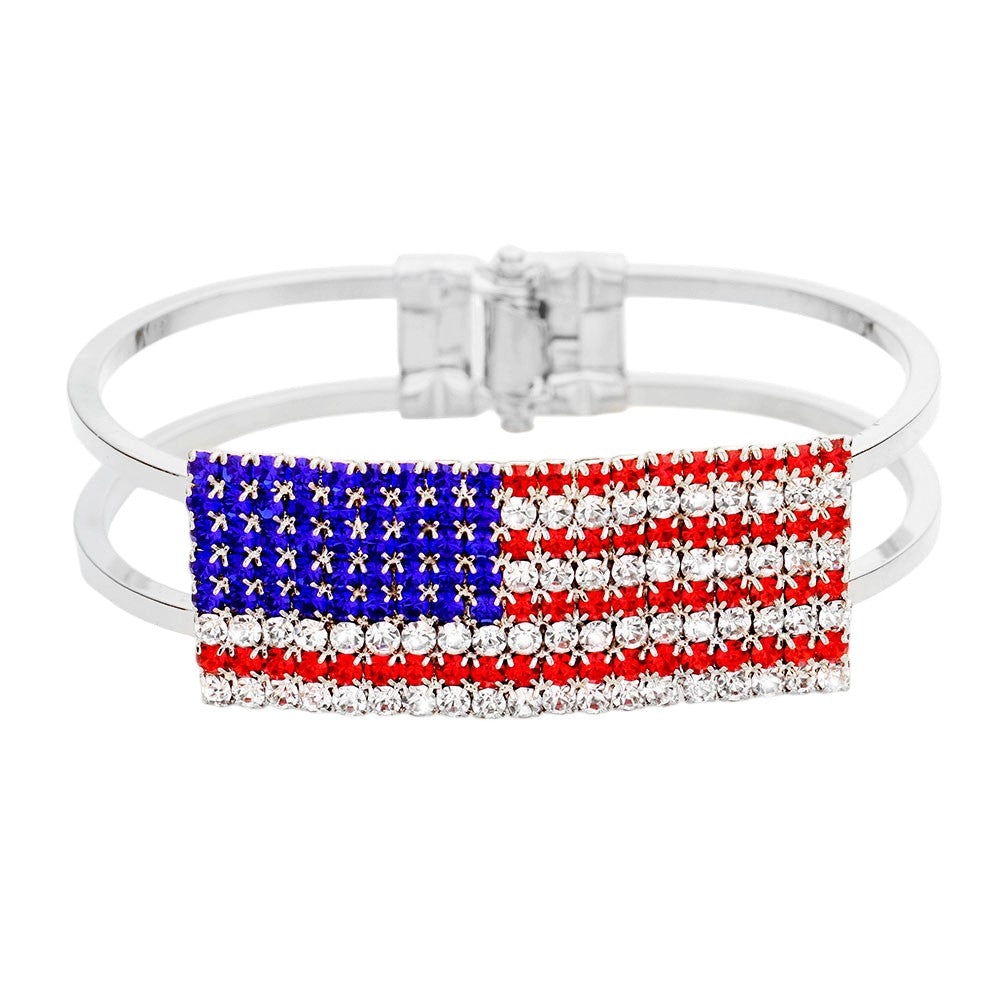 Silver Multi Crystal Pave American Flag Hinged Bracelet showcases expert craftsmanship with stunning crystal pave detailing and a hinged design for easy wear. Made with precision and quality materials, this bracelet is a luxurious addition to any ensemble. Show your patriotism and elevate your style with this elegant bracelet.