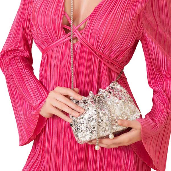 Silver Add a touch of whimsy to your wardrobe with our Pearl Tip Chain Mini Sequin Crossbody Bag. Featuring a playful pearl-tipped chain and shimmering sequin detailing, this bag is both fun and fashionable. Perfect for any occasion, it's the perfect accessory to add some personality to your look.