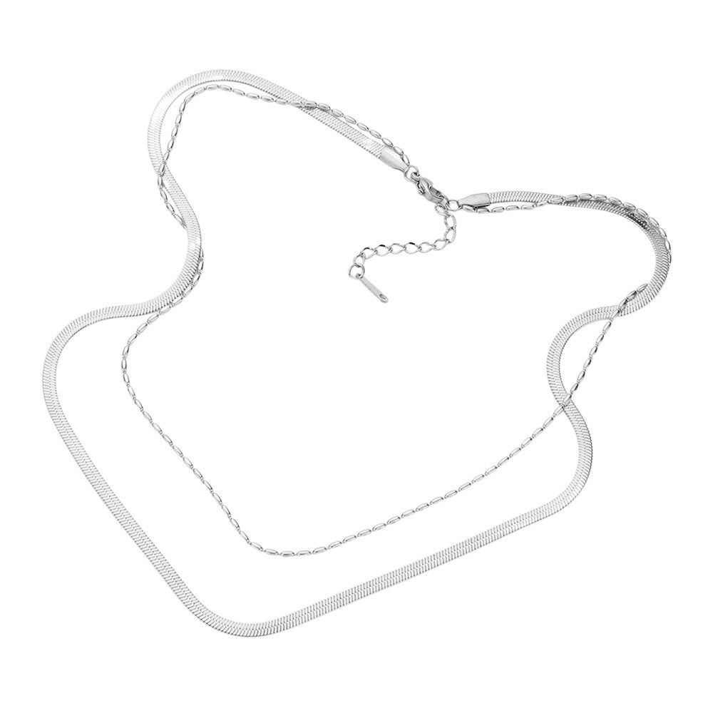 Silver Stainless Steel Herringbone Chain Layered Necklace offers a sleek and stylish addition to any outfit. Crafted from high-quality stainless steel, this necklace is durable and resistant to tarnishing. Its herringbone chain design adds a unique touch, making it a versatile piece for any occasion. Elevate your look with this modern and sophisticated accessory.