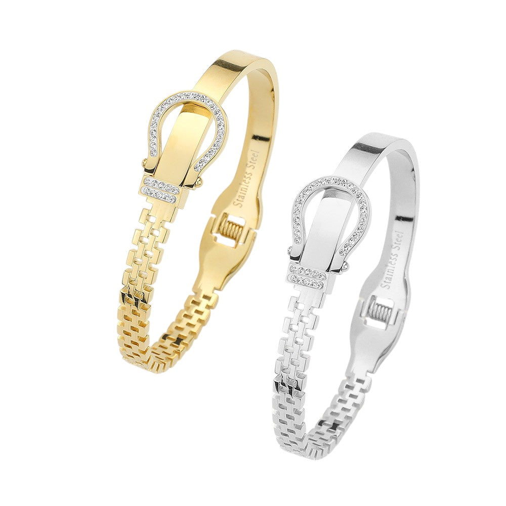 Silver Stainless steel bracelet features a stunning rhinestone belt buckle design with a hinged closure for a secure fit. Crafted with durable materials, this stylish accessory is perfect for adding a touch of elegance to any outfit. The perfect blend of fashion and function.