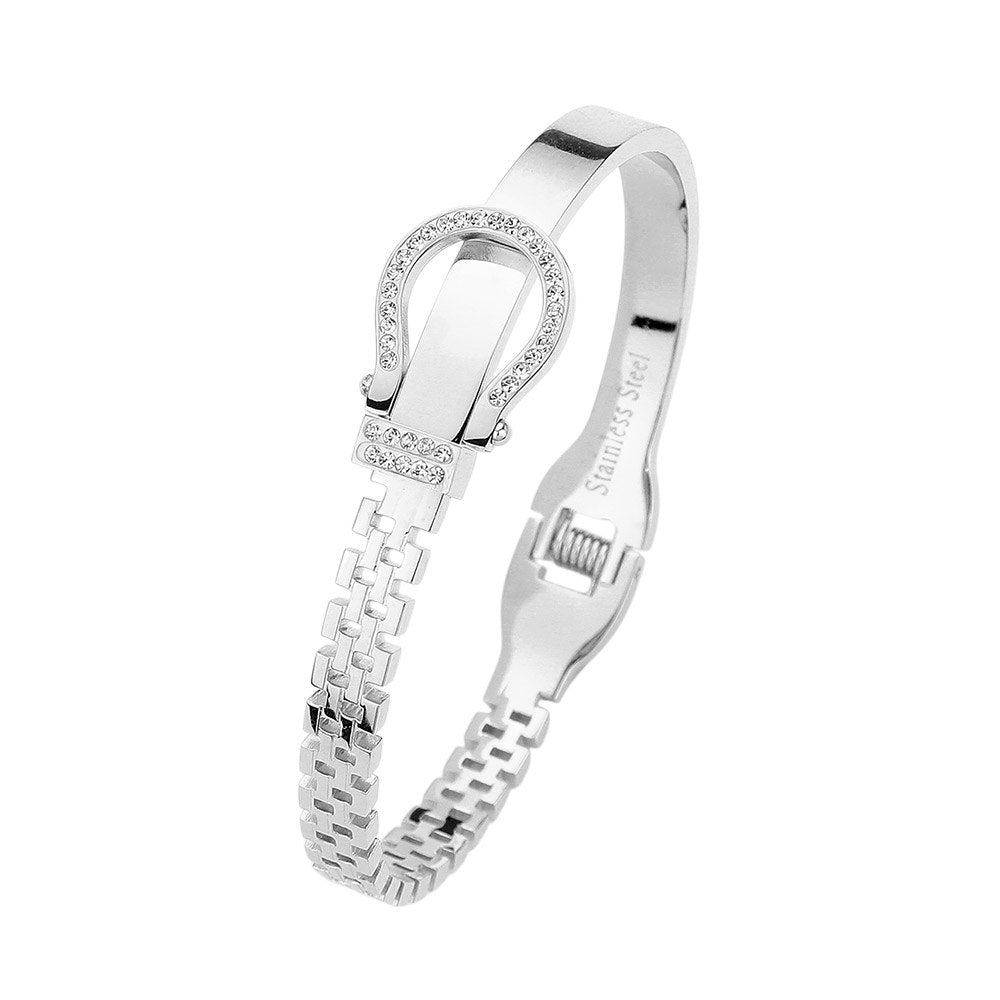 Silver Stainless steel bracelet features a stunning rhinestone belt buckle design with a hinged closure for a secure fit. Crafted with durable materials, this stylish accessory is perfect for adding a touch of elegance to any outfit. The perfect blend of fashion and function.