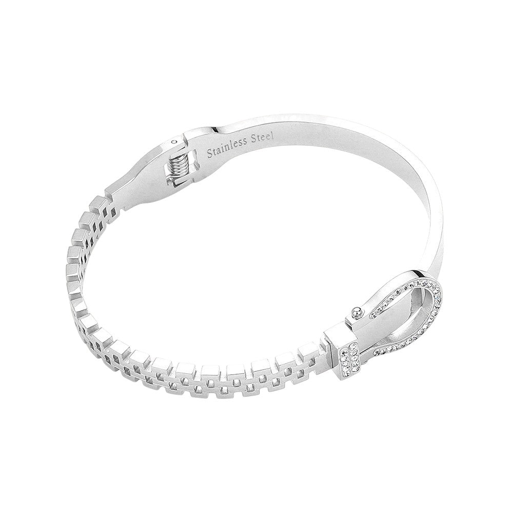 Silver Stainless steel bracelet features a stunning rhinestone belt buckle design with a hinged closure for a secure fit. Crafted with durable materials, this stylish accessory is perfect for adding a touch of elegance to any outfit. The perfect blend of fashion and function.
