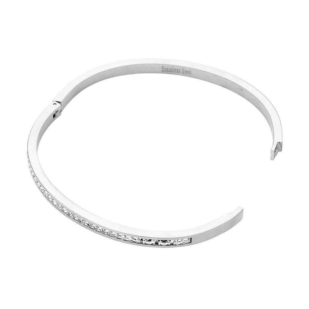 Silver Stainless Steel Rhinestone Paved Hinged Bangle Bracelet is durable and stylish for any occasion. Featuring a sleek stainless steel design and sparkling rhinestone accents, this hinged bangle is perfect for adding a touch of elegance to any outfit. With its sturdy construction and eye-catching design, this bracelet is a must-have for any fashion-forward individual.